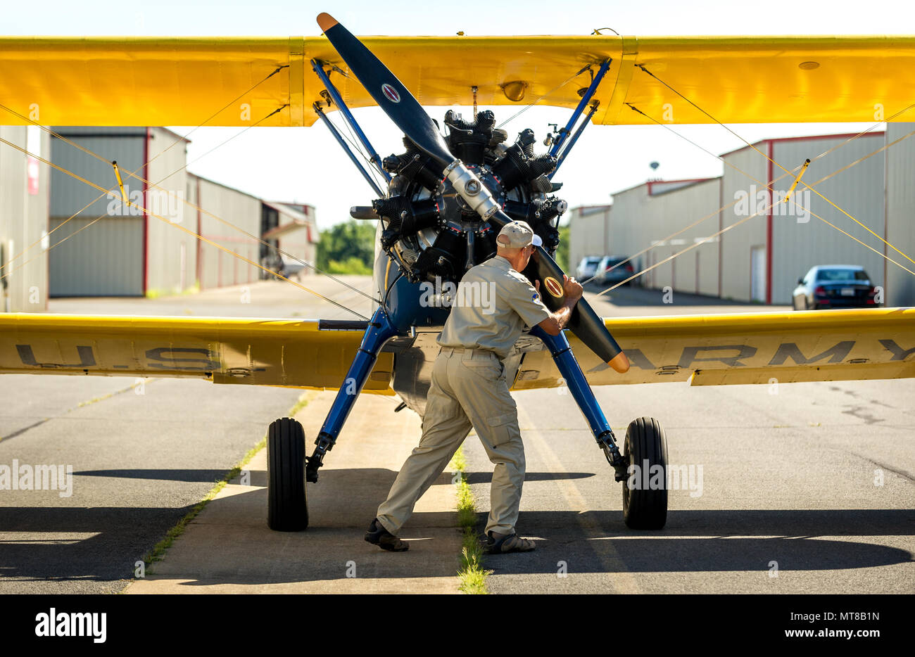 First Sgt. David Brown, Air Force Reserve, prepares his PT-17 Stearman biplane for takeoff before flying with Al Tucker Jr., 96, from the Warrenton-Fauquier Airport in Warrenton Va., to the Flying Circus Aerodrome and Airshow in Bealeton, Va., Jul. 30, 2017. (U.S. Air Force photo by J.M. Eddins Jr.) Stock Photo