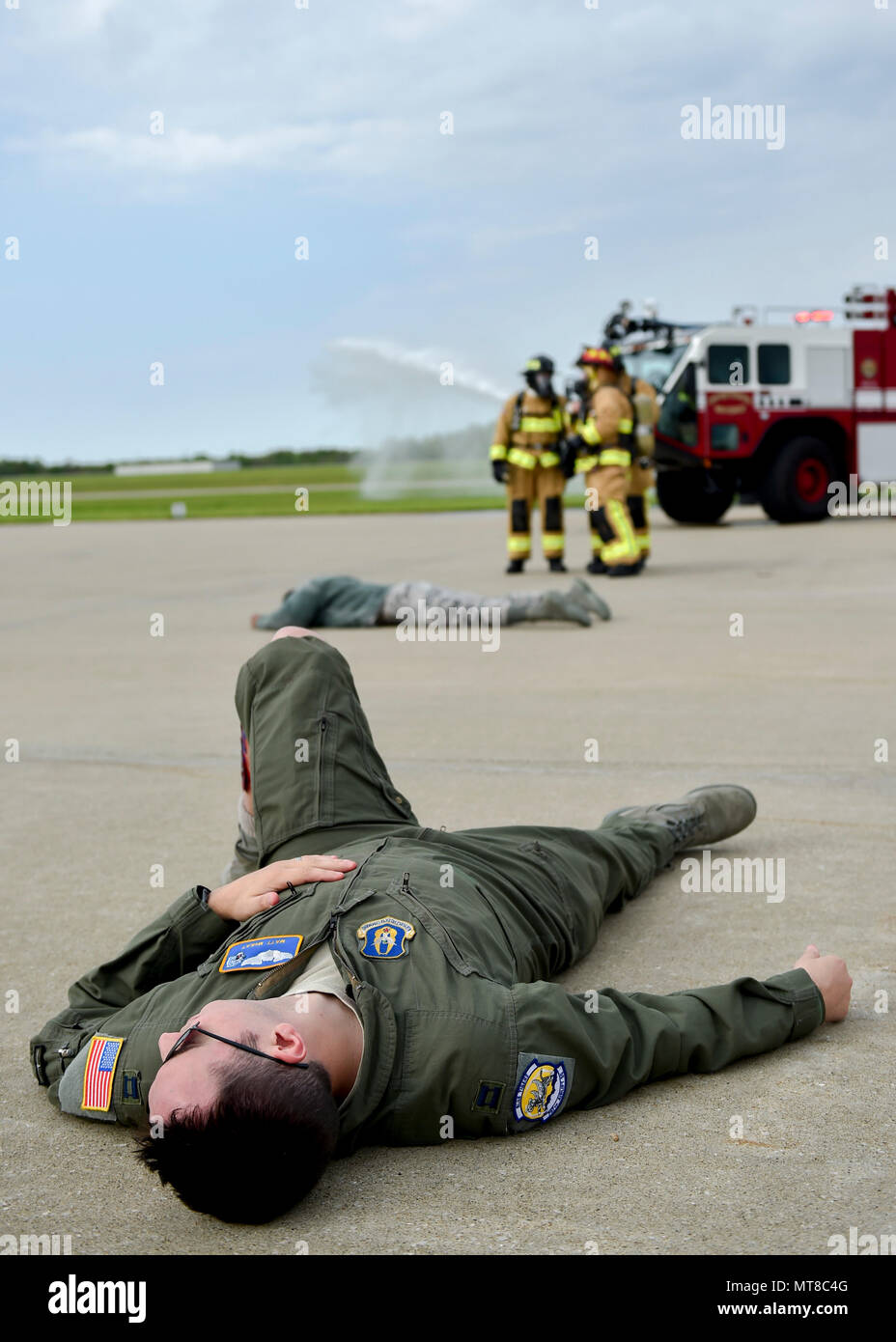 Capt. Matt McKay, a pilot trainee with the 757th Airlift Squadron here, portrays an accident victim during a Major Accident Response Exercise (MARE), May 16, 2017, while installation firefighters arrive and coordinate their initial response. The purpose of the exercise, conducted by the Wing Inspection Team and Emergency Management office, was to document response capabilities of installation personnel while honing joint response practices with local agencies including local law enforcement and the American Red Cross. (U.S. Air Force photo/Eric White) Stock Photo