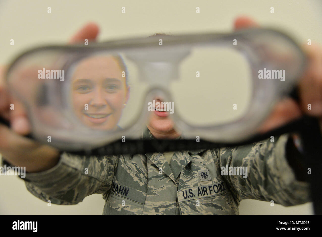 Staff Sgt. Allison Hahn, 341st Medical Operations Squadron NCO in charge of mental health, holds goggles that simulate being under the influence of alcohol March 21, 2017, at Malmstrom Air Force Base, Mont. In addition to mental health, the Alcohol and Drug Abuse Prevention and Treatment program and Family Advocacy Program are also services part of mental health that are available to Airmen and their dependents. (U.S. Air Force photo/Airman 1st Class Daniel Brosam) Stock Photo