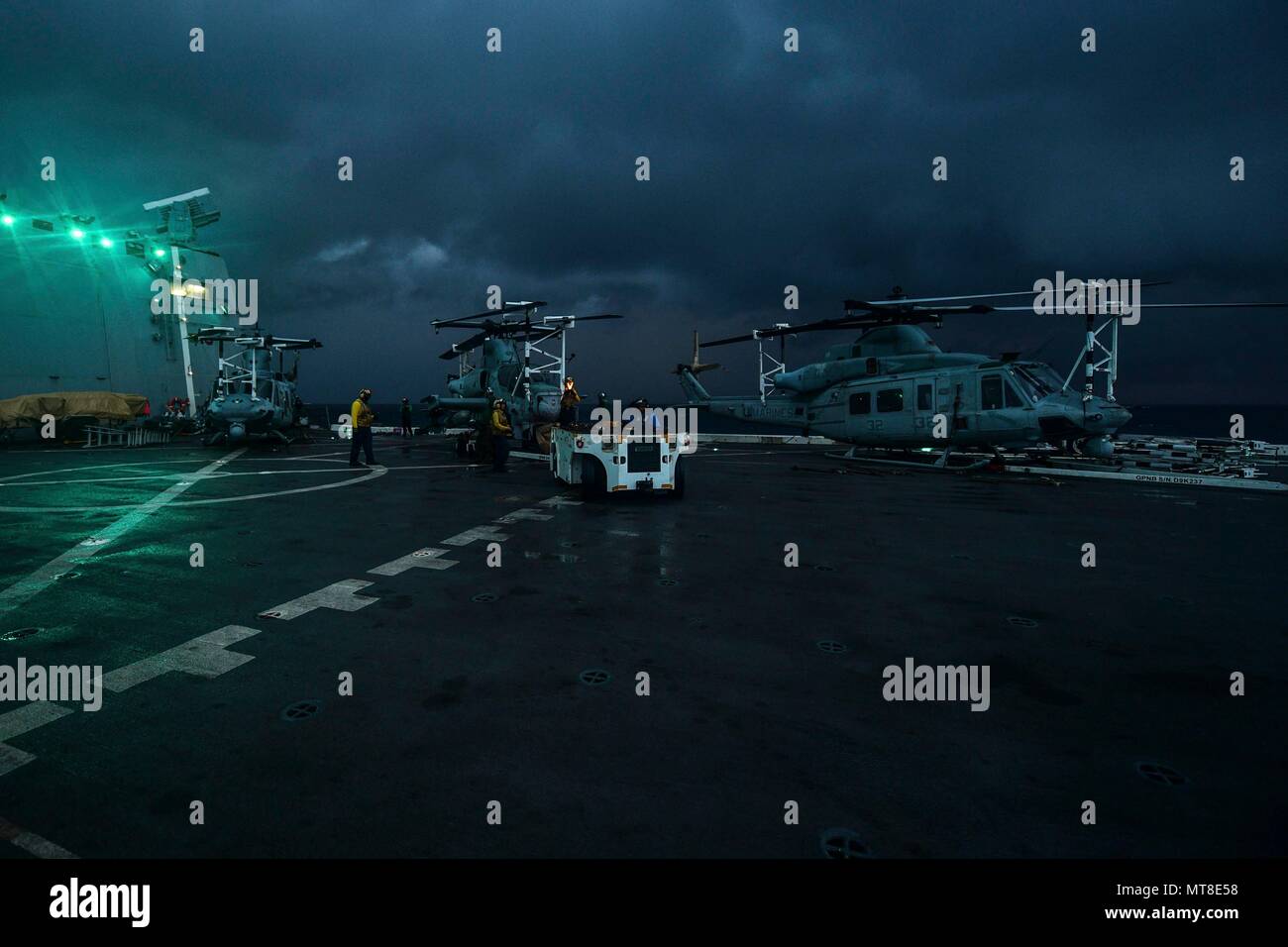 INDIAN OCEAN (Dec. 30, 2017) Sailors conduct flight deck operations on the flight deck of the amphibious transport dock ship USS San Diego (LPD 22). San Diego, part of the America Amphibious Ready Group, with embarked 15th MEU, is operating in the Indo-Asia-Pacificregion to strengthen partnerships and serve as a ready-response force for any type of contingency. (U.S. Navy photo by Mass Communication Specialist 3rd Class Justin A. Schoenberger/Released) Stock Photo