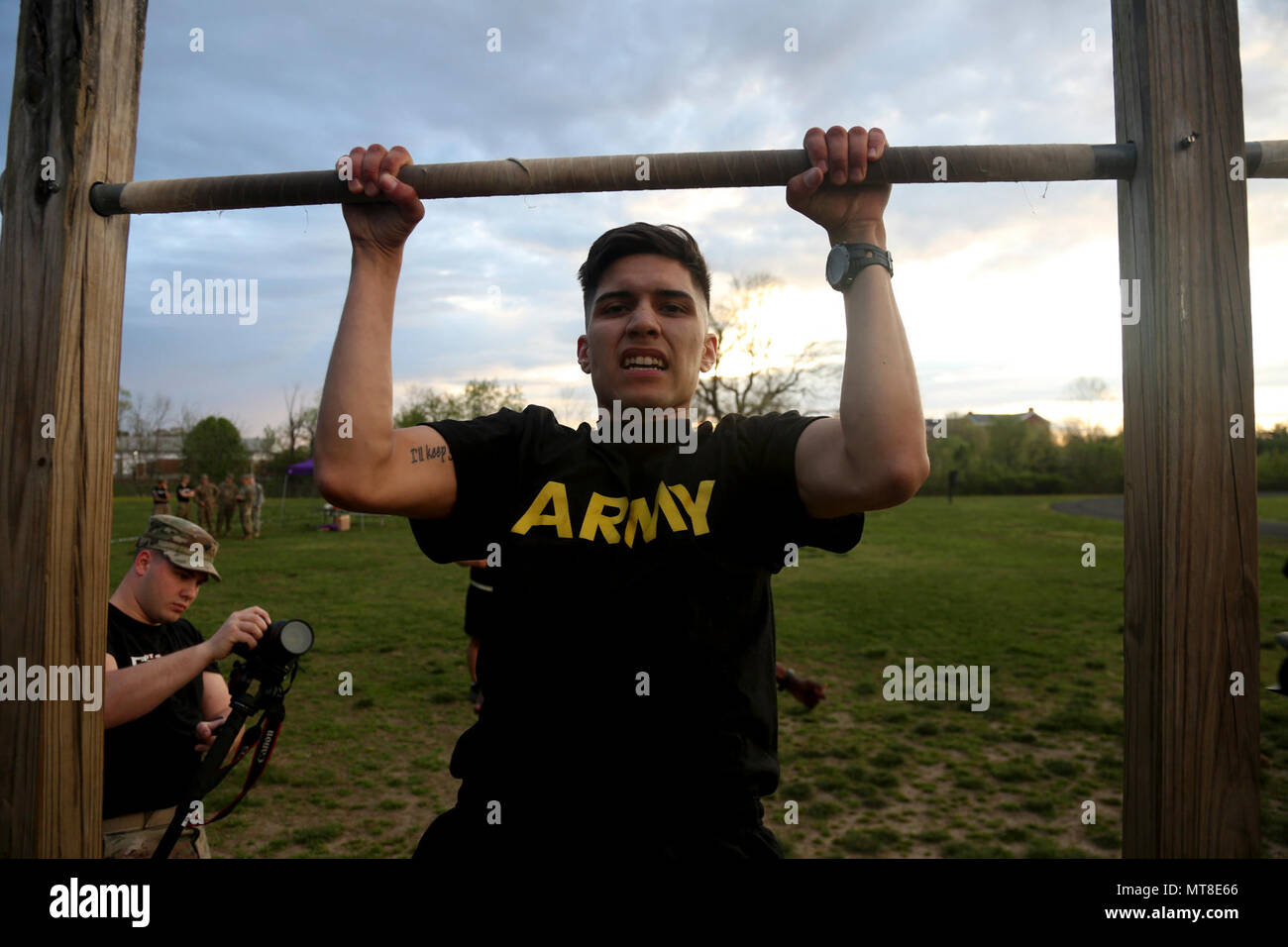 U.S. Army Pfc. Joseph D. Friend, assigned to the 55th Signal Company (Combat Camera), completes his pull-ups during the Hilda’s Challenge in the 2017 5th Annual SPC Hilda I. Clayton Best Combat Camera (COMCAM) Competition at Fort George G. Meade, Md., April 17, 2017. Friend is competing in the 2017 5th Annual Best COMCAM Competition where teams of two compete throughout a weeklong event that tests their physical, mental and technical capabilities.  The Competition is established in honoring fallen combat camera Soldier SPC Hilda I. Clayton, who gave her life July 02, 2013 in Afghanistan as a p Stock Photo