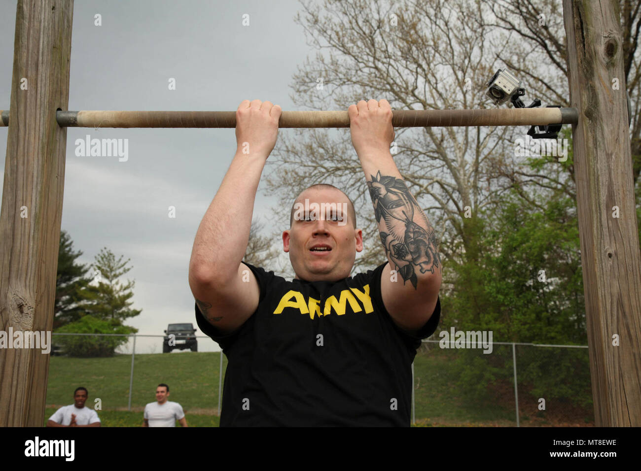 U.S. Army Sgt. Franklin Moore, a Combat Documentation/ Production Specialist, assigned to the 55th Signal Company (Combat Camera), conducts 55 pull-ups during the Hilda Challenge in the 2017 5th Annual SPC Hilda I. Clayton Best Combat Camera (COMCAM) Competition at Fort George G. Meade, Md., April 17, 2017. Moore is competing in the 2017 5th Annual Best COMCAM Competition where teams of two compete throughout a weeklong event that tests their physical, mental and technical capabilities. The Competition is established in honoring fallen combat camera Soldier SPC Hilda I. Clayton, who gave her l Stock Photo