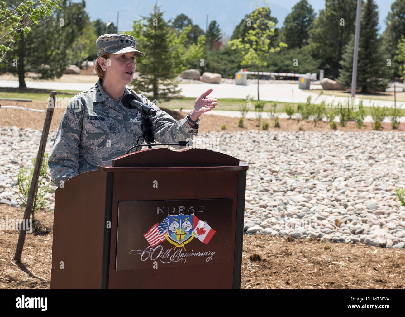 U.S. Air Force General Lori Robinson, Commander of the North American Aerospace Defense Command and U.S. Northern Command speaks during the unveiling ceremony for a memorial cairn outside the NORAD and USNORTHCOM headquarters building on Peterson Air Force Base, Colorado, May 11. The cairn honors the Canadian service men and women who passed away while serving at NORAD in Colorado Springs. The placement and dedication of the cairn was conducted in conjunction with the 60th Anniversary of NORAD and the U.S. Canadian binational NORAD agreement. (DoD Photo By N&NC Public Affairs) Stock Photo