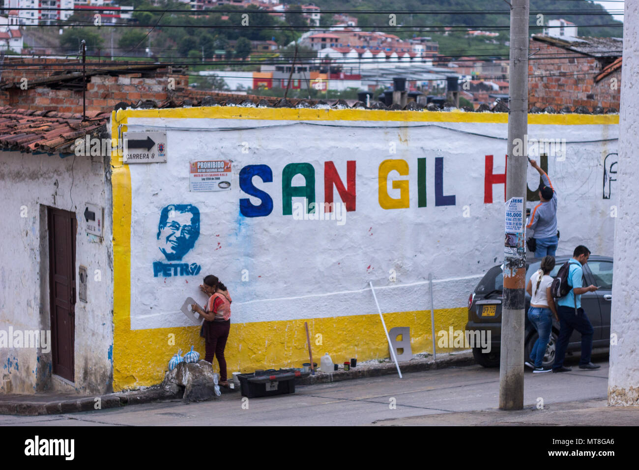 San Gil, Santander / Colombia - 28 april 2018 : Supporters of candidate Petro painting on a wall. Stock Photo