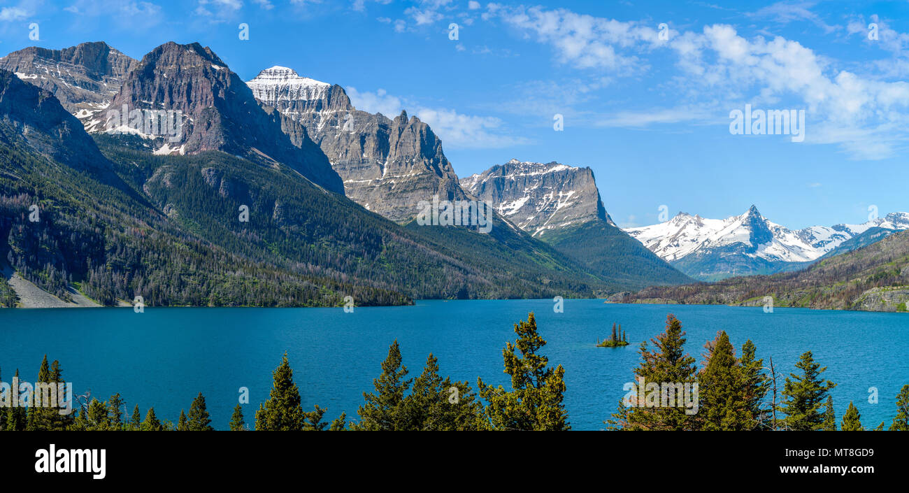 Saint Mary Lake - A panoramic view of Saint Mary Lake and its surrounding steep mountains, seen from Going-To-The-Sun Road, in Glacier National Park. Stock Photo