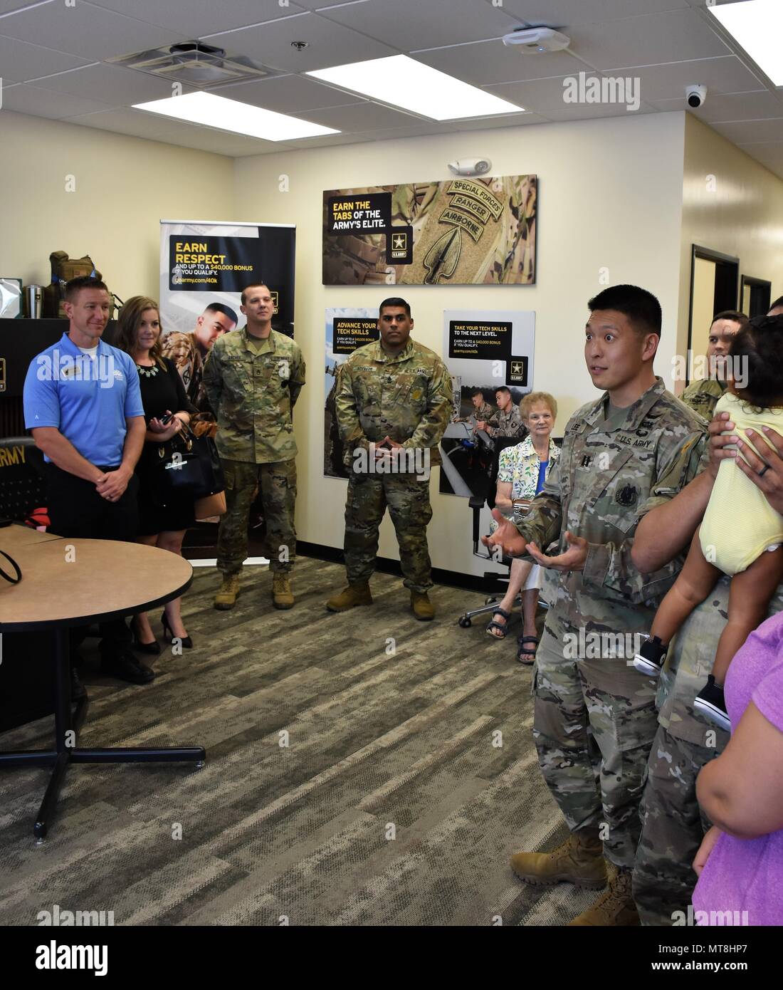 Capt. Eugene Lee, commander, Phoenix West Recruiting Company, talks to community partners, guests, recruiters and their spouses, at a Ribbon Cutting Ceremony for Estrella Recruiting Station, May 14, Goodyear, Ariz. (U.S. Army Photo by Alun Thomas, USAREC Public Affairs) Stock Photo
