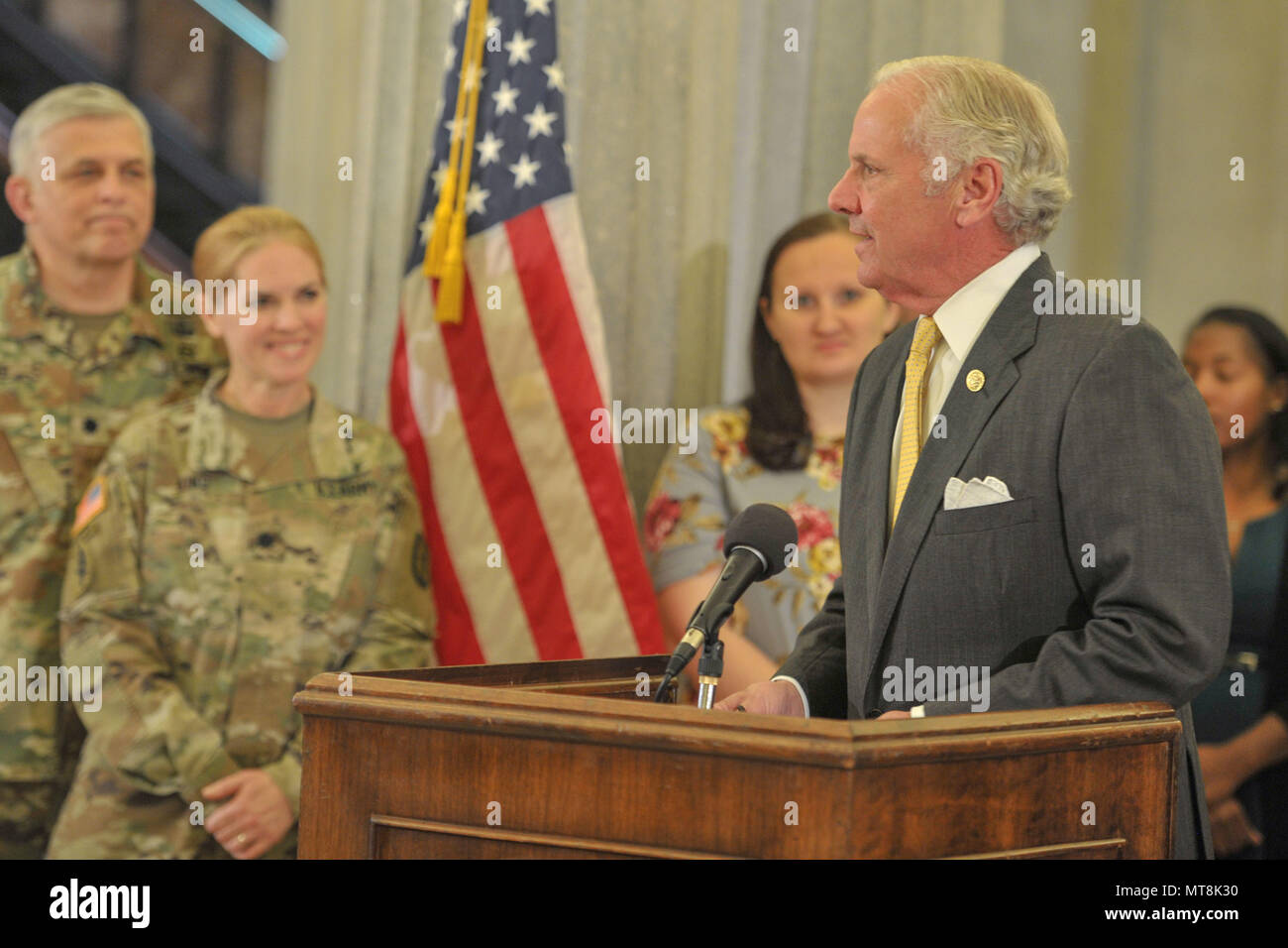 South Carolina Gov. Henry McMaster presents a Proclamation recognizing May as Military Spouse Appreciation month throughout South Carolina, joined by U.S. Army Maj. Gen. Robert E. Livingston, Jr. the adjutant general for South Carolina and his wife Barbara, Fort Jackson's Military Family of the Year, Staff Sgt. John Berta and his wife Agata, U.S. Coast Guard Petty Officer Jerry Stevens and his wife Sarah, and other military members with the spouses from the South Carolina Army and Air National Guard.  Receiving special recognition were four spouses of South Carolina Army National Guard Soldier Stock Photo