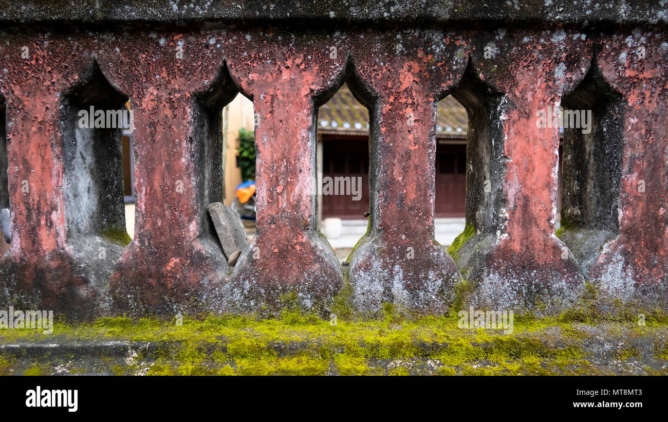 Masonry wall with decorative gaps and moss Stock Photo