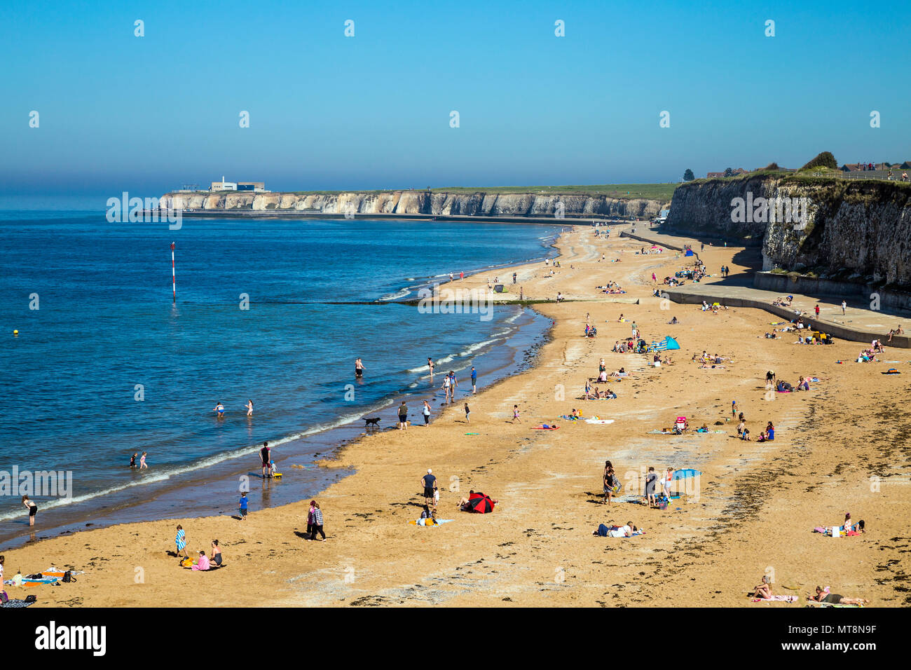 Crowds of beachgoers in the summer at Palm Bay sandy beach near Margate, Kent, UK Stock Photo