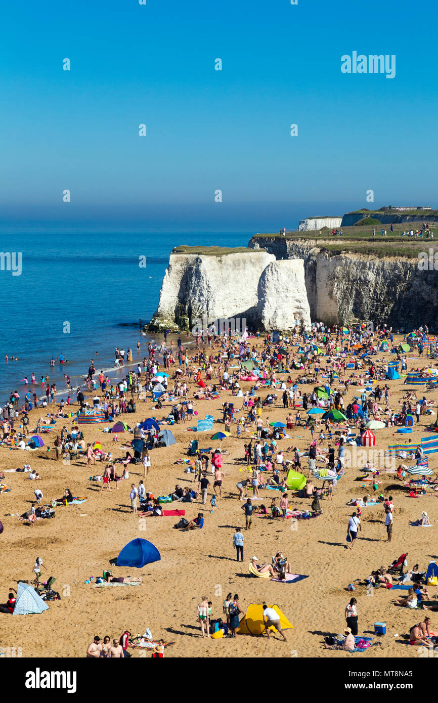 Crowds of beachgoers on the sandy beach of Botany Bay, Kent. UK Stock Photo