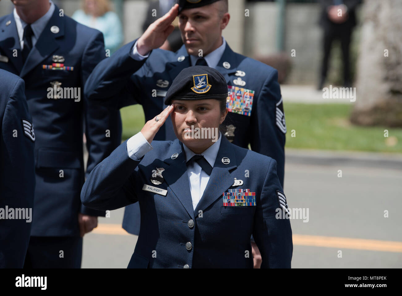 Staff Sgt. Miranda Kalander, 60th Security Forces Squadron military working dog handler, holds a salute during the 29th Annual Peace Officer’s Memorial Ceremony in Fairfield, Calif., May 16, 2018. Nearly a dozen security forces members participated in the ceremony to honor fallen peace officers. (U.S. Air Force photo by Tech. Sgt. James Hodgman) Stock Photo