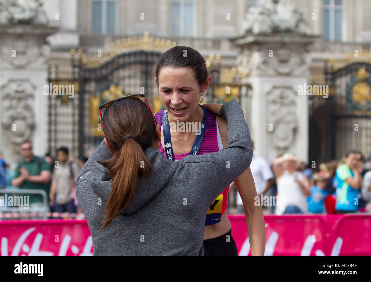 London,UK,28th May 2018,Jo Pavey winner of the Female Vitality London 10,000 collects her medal and trophy in London. The 10K run is now in its 10th year and Jessica Ennis-Hill was present to start the race and present the medals. Credit Keith Larby/Alamy Live News Stock Photo