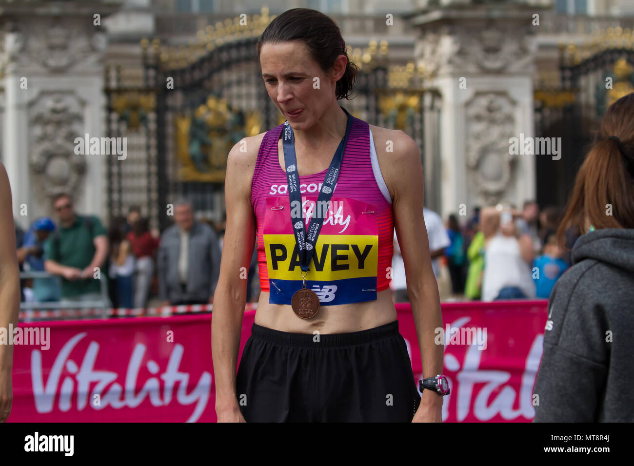 London,UK,28th May 2018,Jo Pavey winner of the Female Vitality London 10,000 collects her medal and trophy in London. The 10K run is now in its 10th year and Jessica Ennis-Hill was present to start the race and present the medals. Credit Keith Larby/Alamy Live News Stock Photo