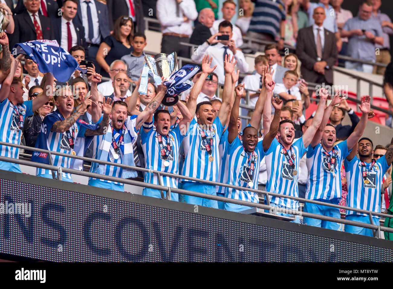 London, UK. 28th May 2018. Michael Doyle of Coventry City lifts the promotion Trophy during the EFL Sky Bet League 2 Promotion Play-Offs Final match between Coventry City and Exeter City at Wembley Stadium, London, England on 28 May 2018. Credit: THX Images/Alamy Live News Stock Photo