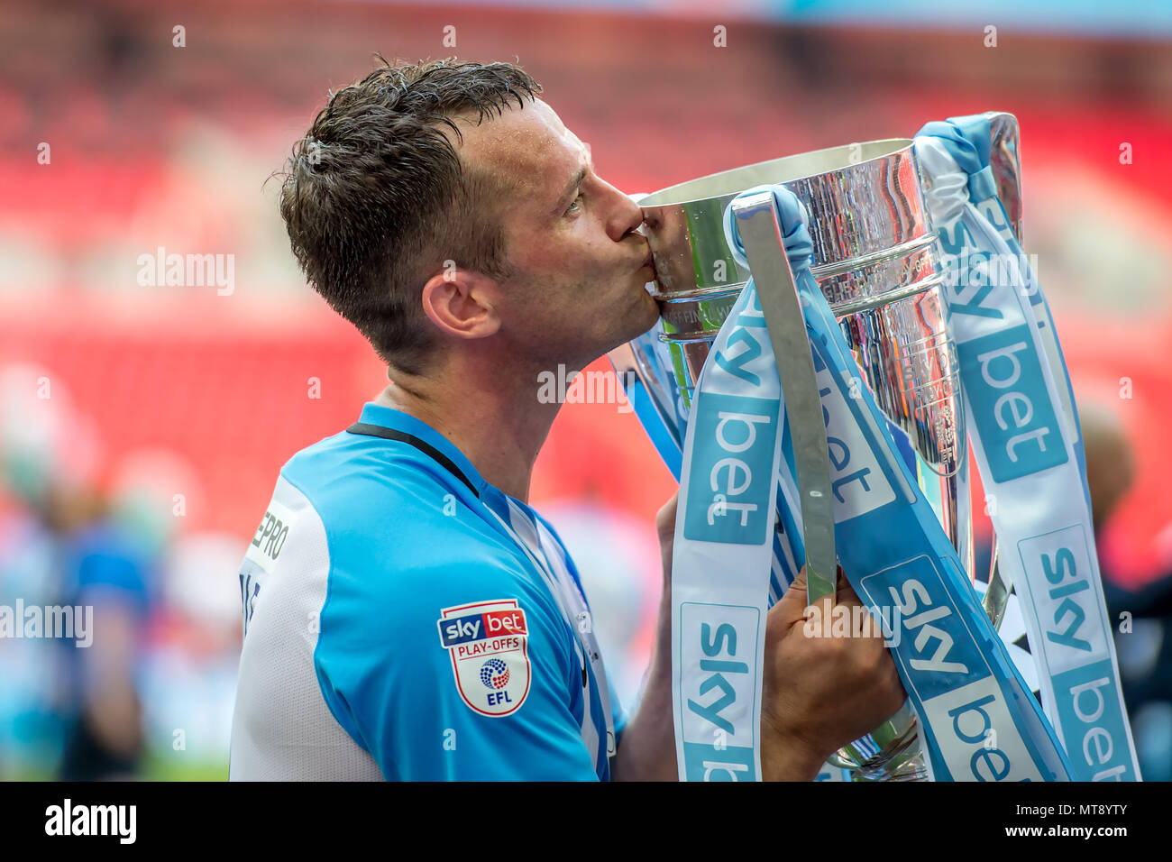 London, UK. 28th May 2018. Captain Michael Doyle of Coventry City kisses the Play-Offs Trophy during the EFL Sky Bet League 2 Promotion Play-Offs Final match between Coventry City and Exeter City at Wembley Stadium, London, England on 28 May 2018. Credit: THX Images/Alamy Live News Stock Photo