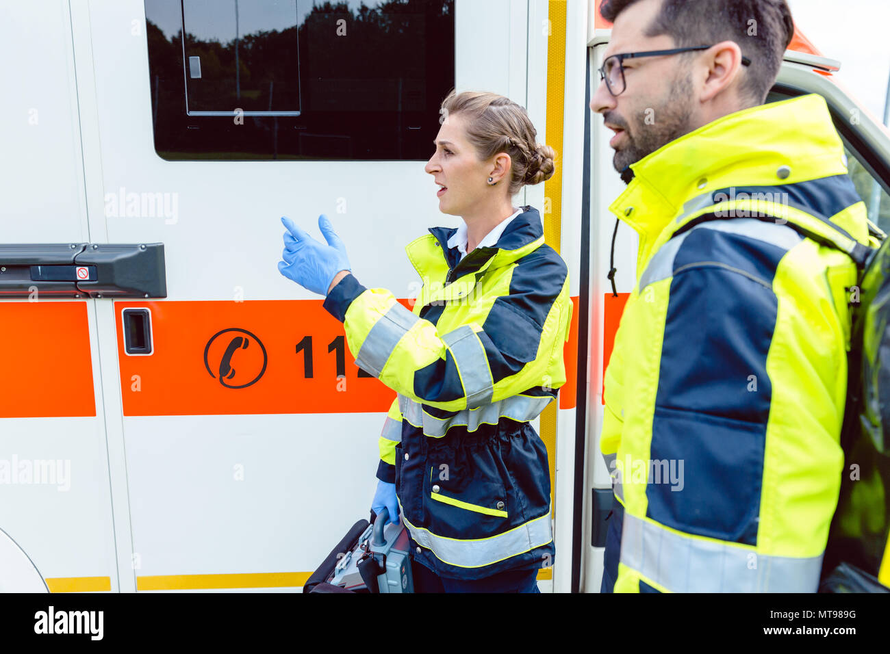 Paramedic nurse and emergency doctor at ambulance Stock Photo