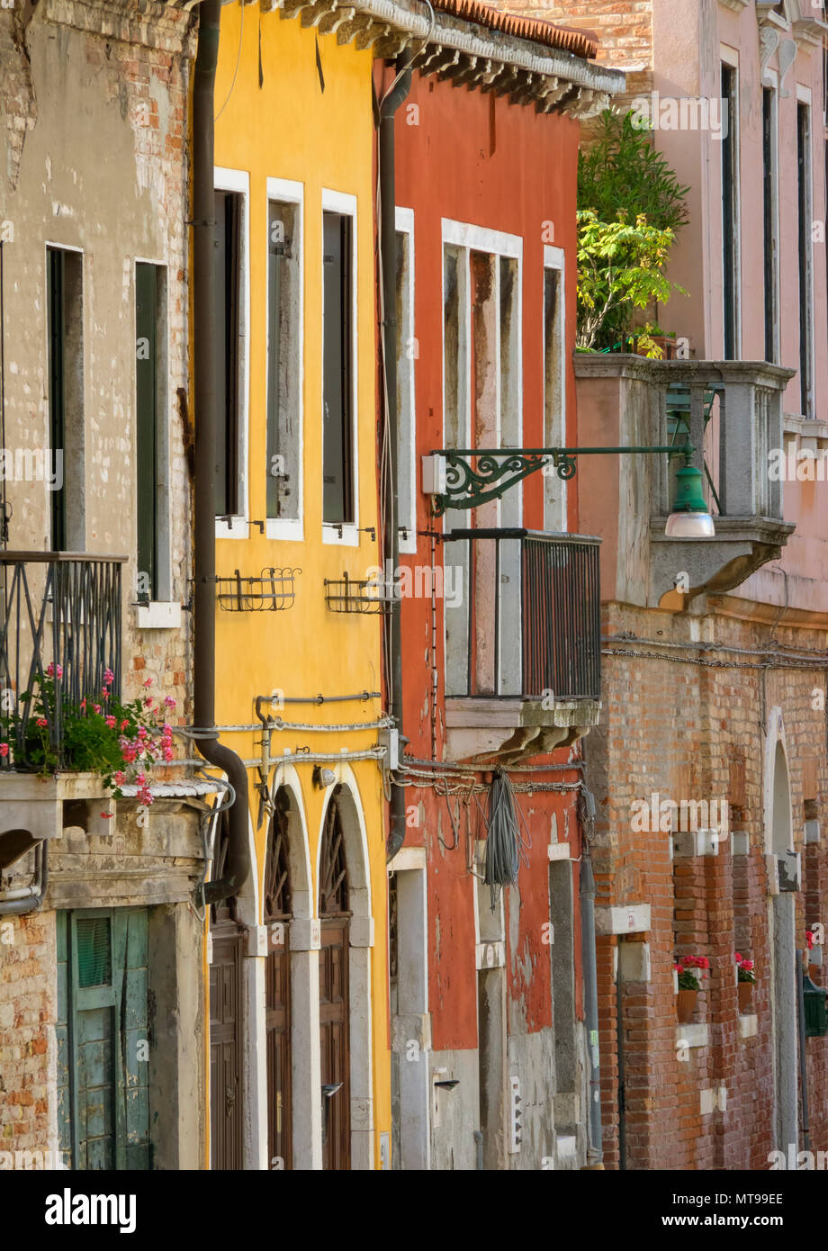 Multi-colored walls of houses in Venice Stock Photo - Alamy