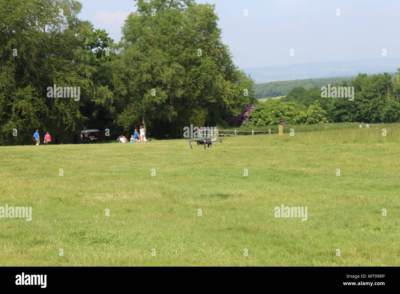 Drone coming into land in a field Stock Photo