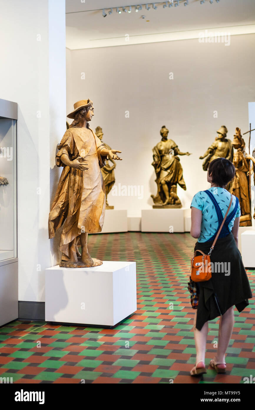 MUNICH, GERMANY - MAY 22, 2018: visitor in hall of Bavarian National Museum in Munich city. Bayerisches Nationalmuseum is decorative arts museum and o Stock Photo