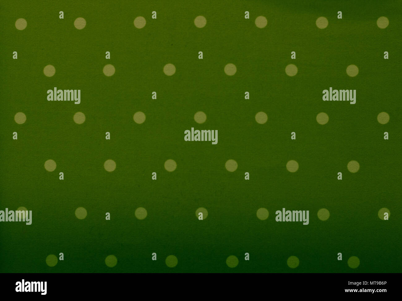 Green fabric and white tiny polka dots background Stock Photo
