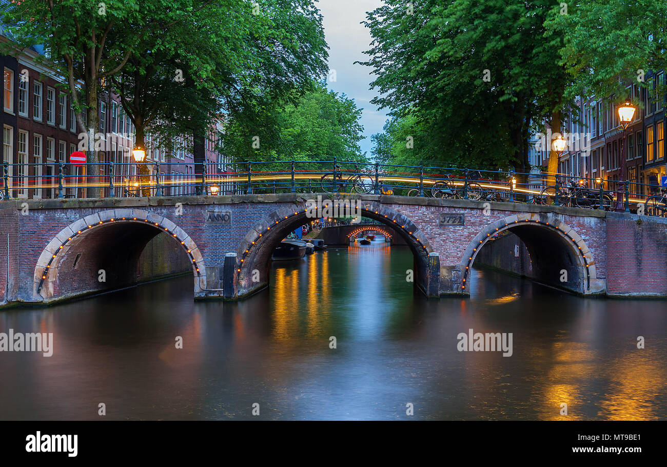 Night city view of Amsterdam canals and seven bridges, Holland Stock