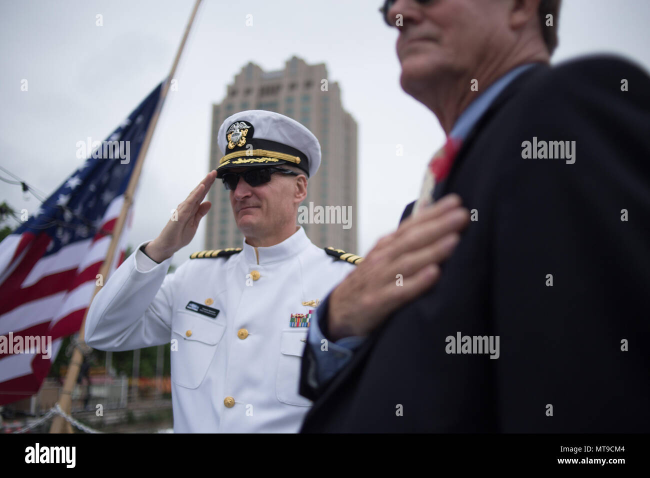 Philadelphia, United States. 28th May, 2018. USN Capt. Francis Spencer salutes while 'Taps' is played during the Memorial Day ceremony onboard the retired USS Olympia, which carried home the remains of the Unknown Soldier interred at Arlington National Cemetery from France in 1921. Credit: Michael Candelori/Pacific Press/Alamy Live News Stock Photo