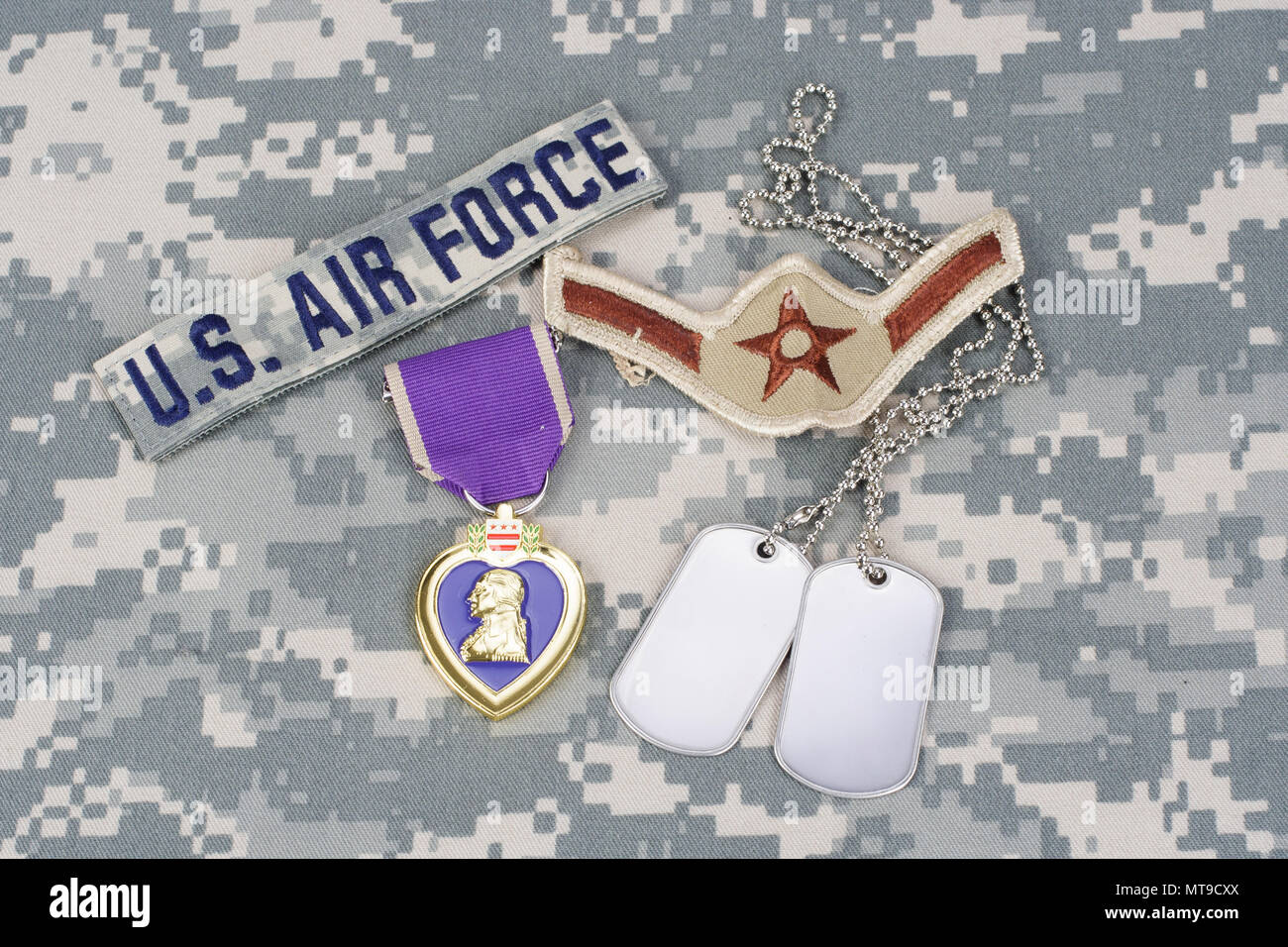KIEV, UKRAINE - March 6, 2016. Purple Heart award with dog tags on US AIR FORCE camouflage uniform Stock Photo
