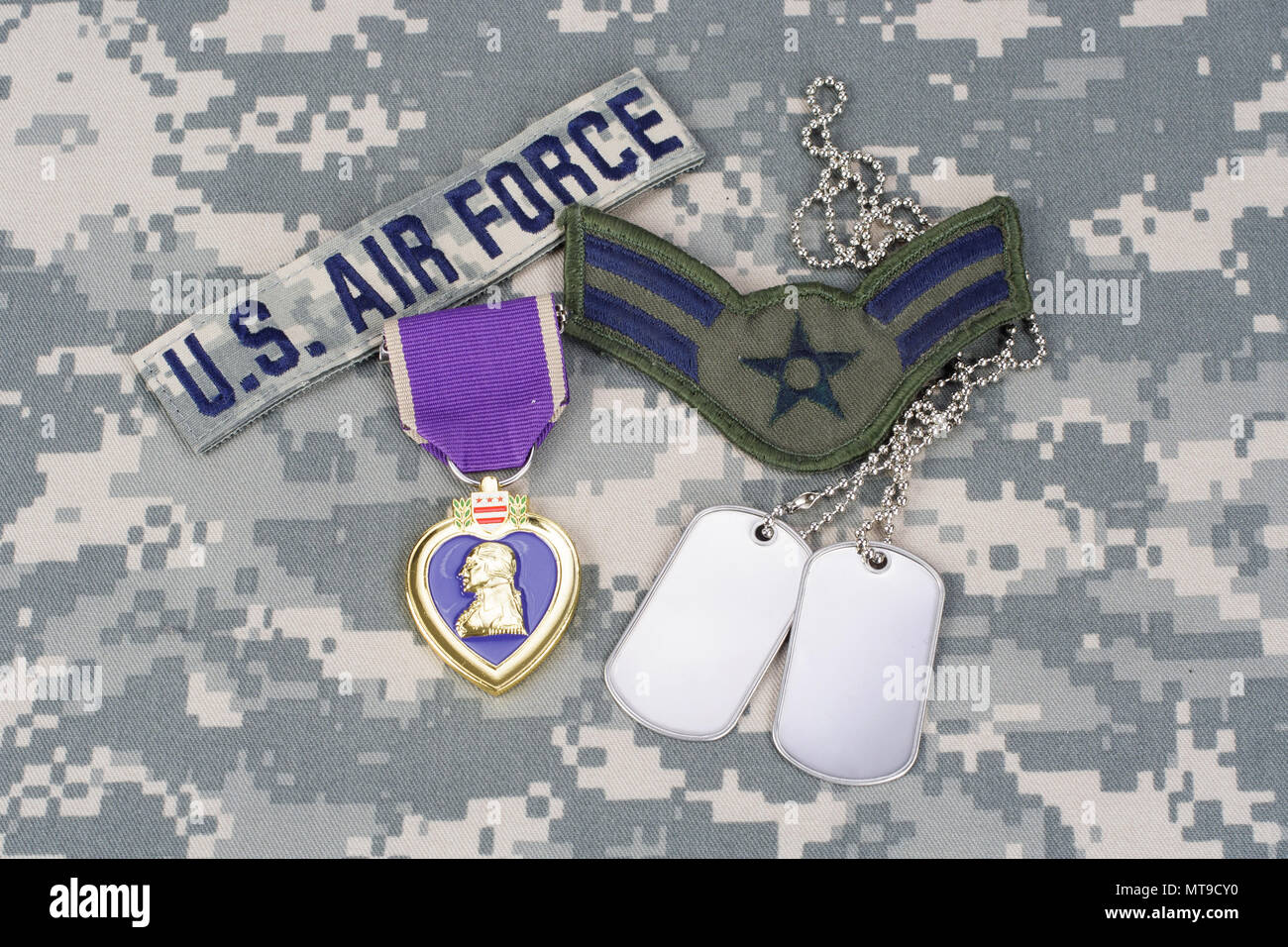 KIEV, UKRAINE - March 6, 2016. Purple Heart award with dog tags on US AIR FORCE camouflage uniform Stock Photo