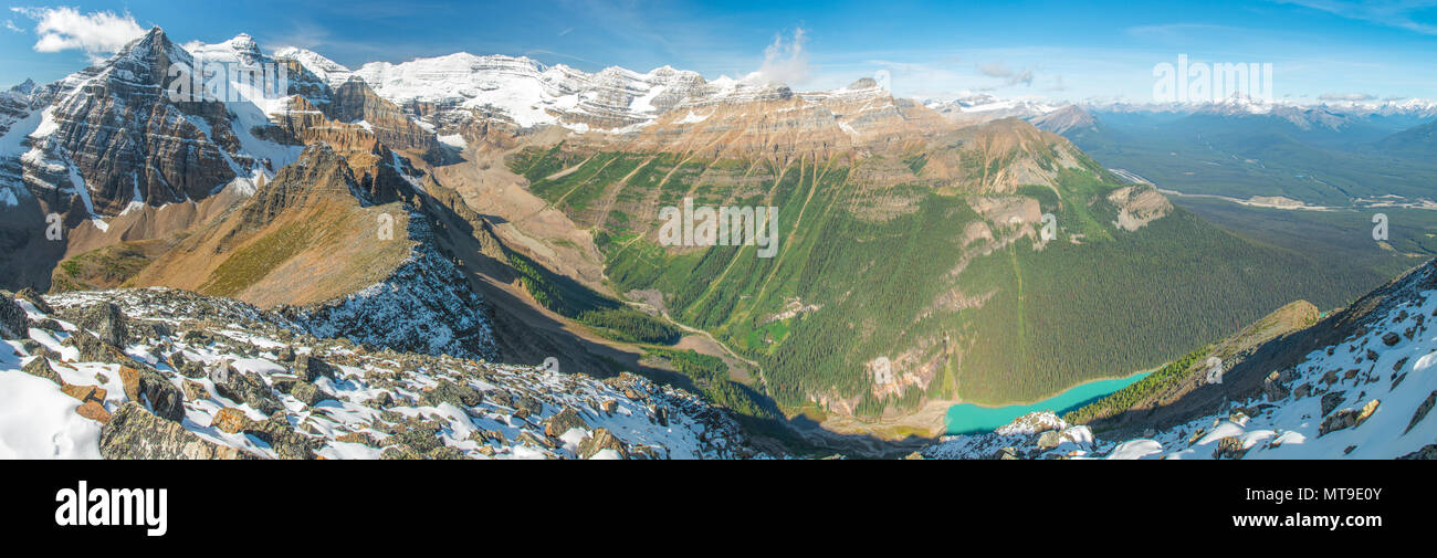 Breathtaking view from Mount Fairview of the plain of Six Glaciers, Lake Louise, snow capped mountains and glacial ridge. Boreal forest vastness. Stock Photo