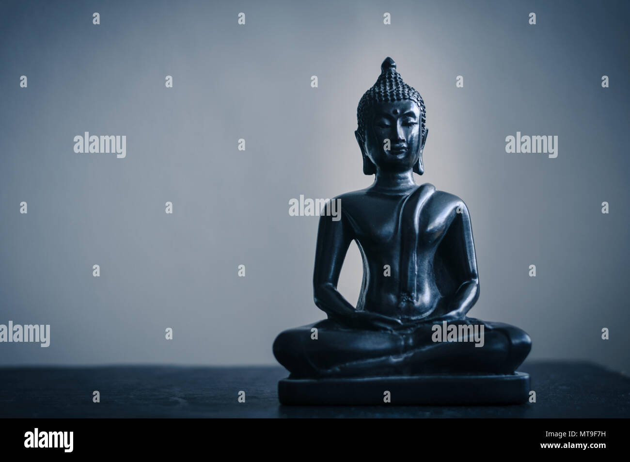 black statue of Buddha Stock Photo - Alamy