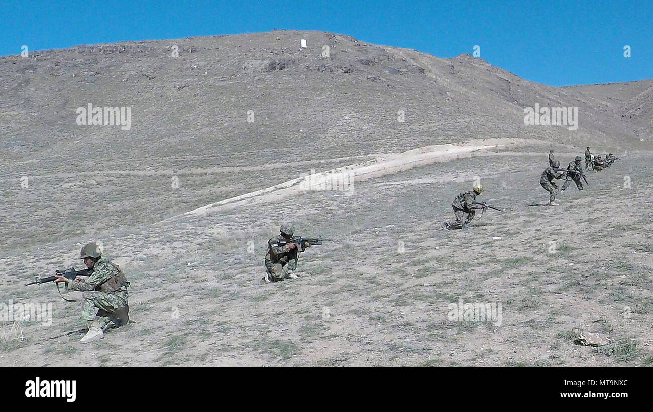 A squad of Soldiers from the Afghan National Army of the 203rd Thunder Corps conduct squad maneuvers and battle drill training and to learn how to better work together at FOB Thunder’s training range in Gardez, Afghanistan. Stock Photo