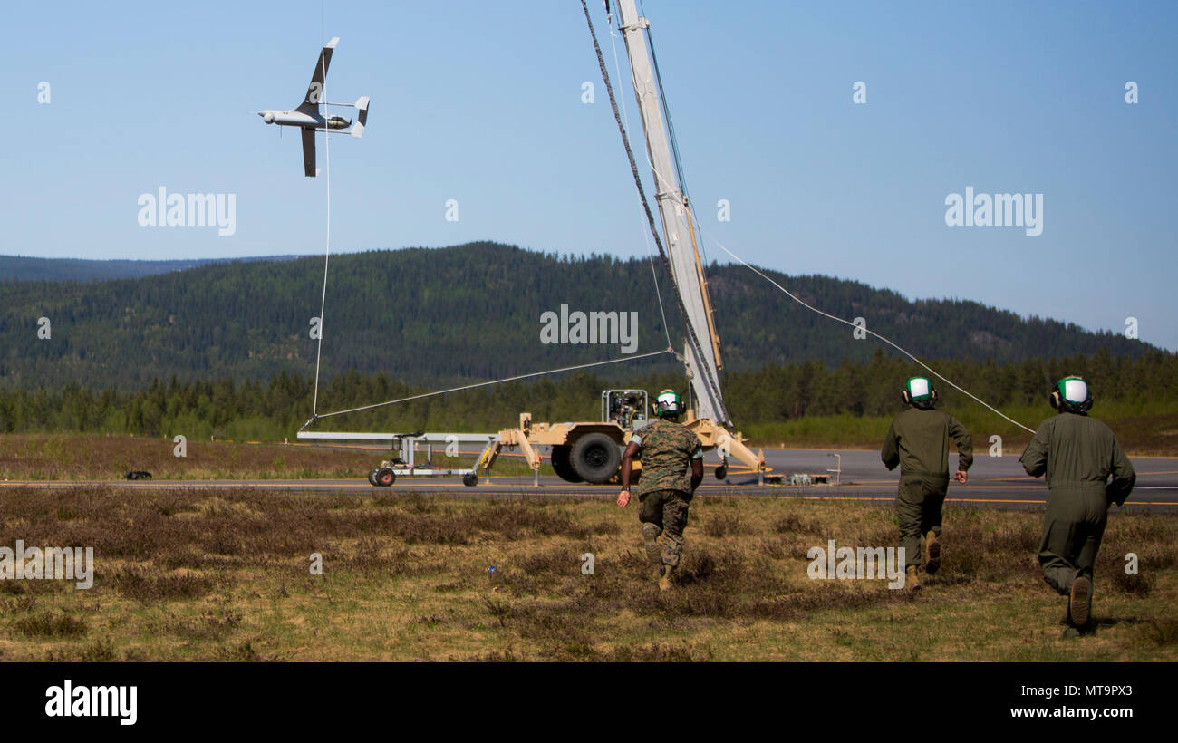 U.S. Marines with Marine Unmanned Aerial Vehicle Squadron 2 recover a  RQ-21A Blackjack during Frozen Reindeer in Rena, Norway, May 19, 2018.  Frozen Reindeer is a training exercise designed to build flight
