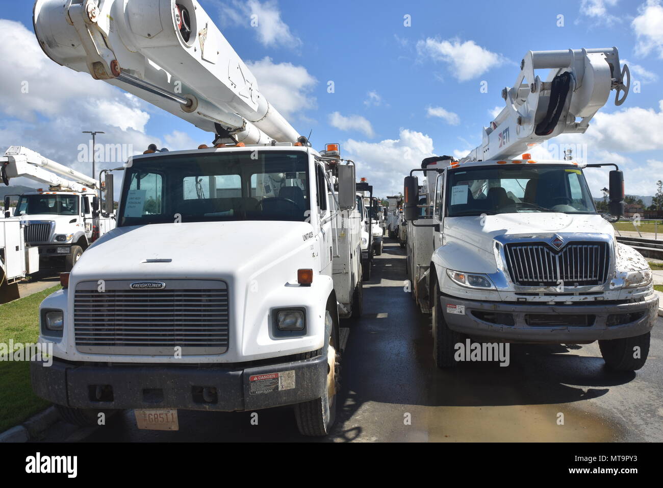 CAGUAS, Puerto Rico Electric work trucks are staged for movement at a supply depot in Caguas