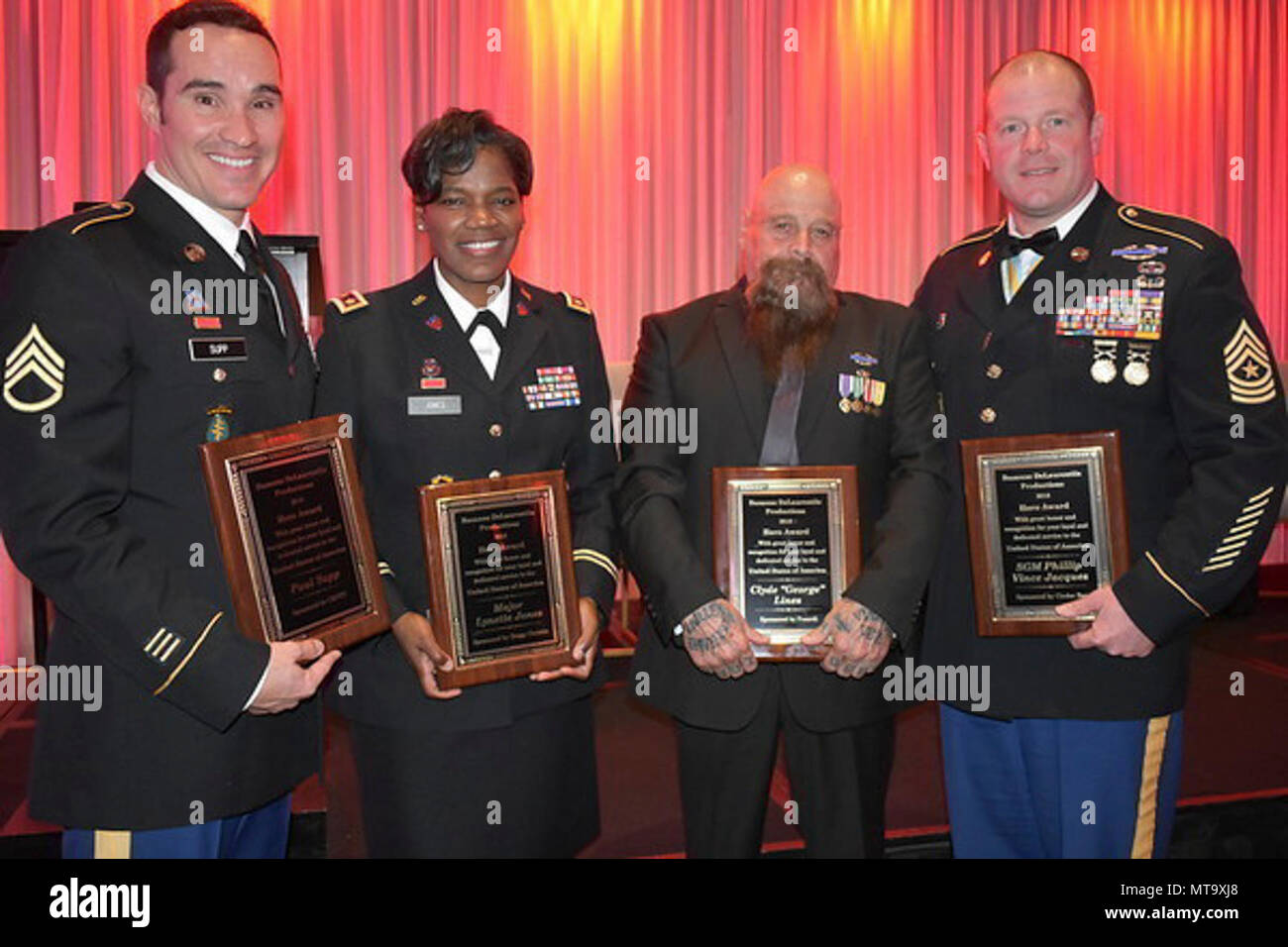 Veterans were recognized with the Hero Award at a gala event sponsored by Suzanne DeLaurentiis Productions at the InterContinental Hotel in Burbank, California, March 3, 2018. Pictured from left: Staff Sgt. Paul Supp; Maj. Lynette Jones; Vietnam Veteran Clyde “George” Lines; and Oregon Army National Guard Sgt. Maj. Vinnie Jacques (right), Senior Enlisted Advisor to Joint Domestic Operations Commander. Jacques was a former platoon sergeant with 3rd Platoon, Bravo Company, 2nd Battalion, 162nd Infantry Regiment, which received the Presidential Unit Citation for their heroic efforts during some o Stock Photo
