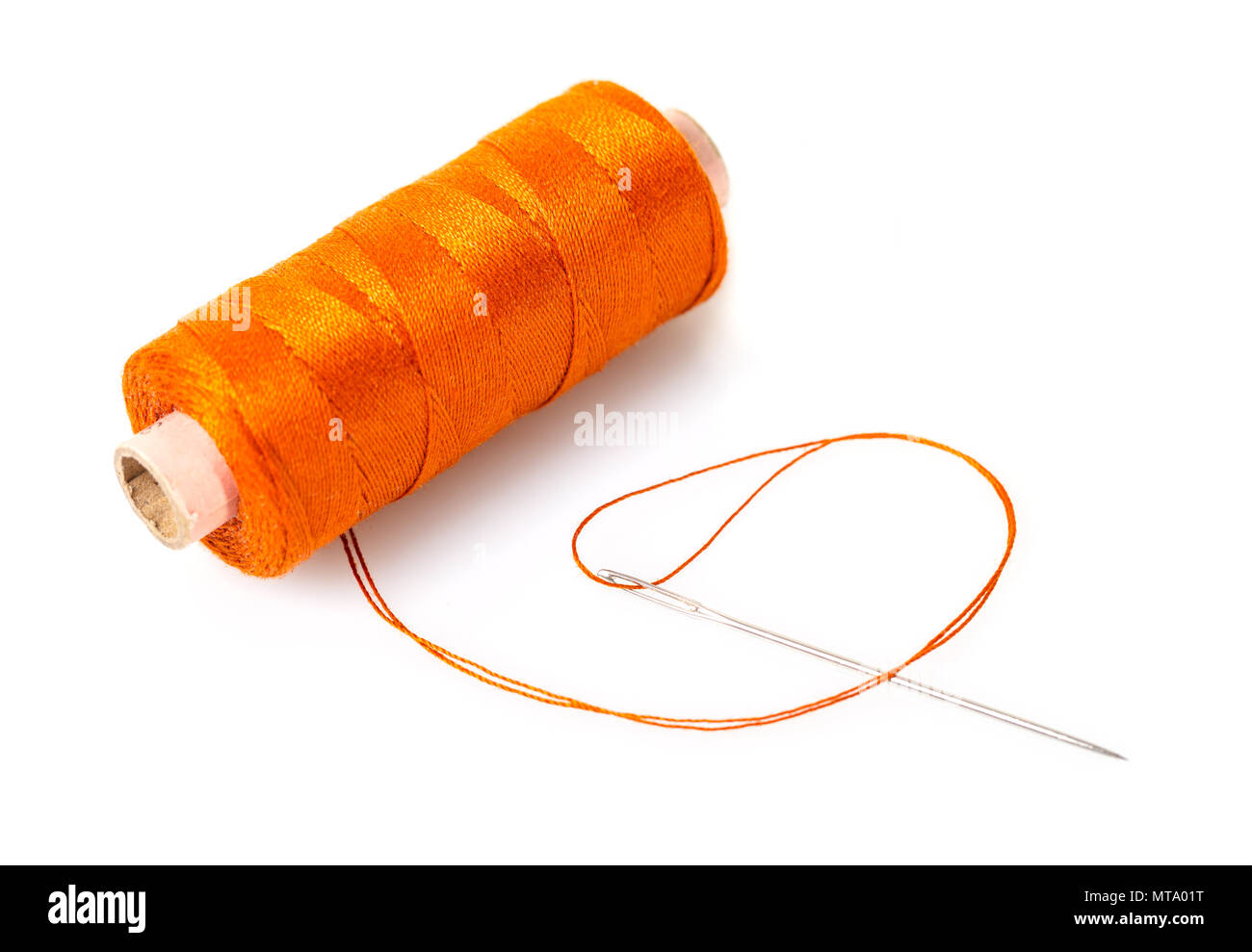 spool of thread with a needle on white isolated background Stock Photo ...