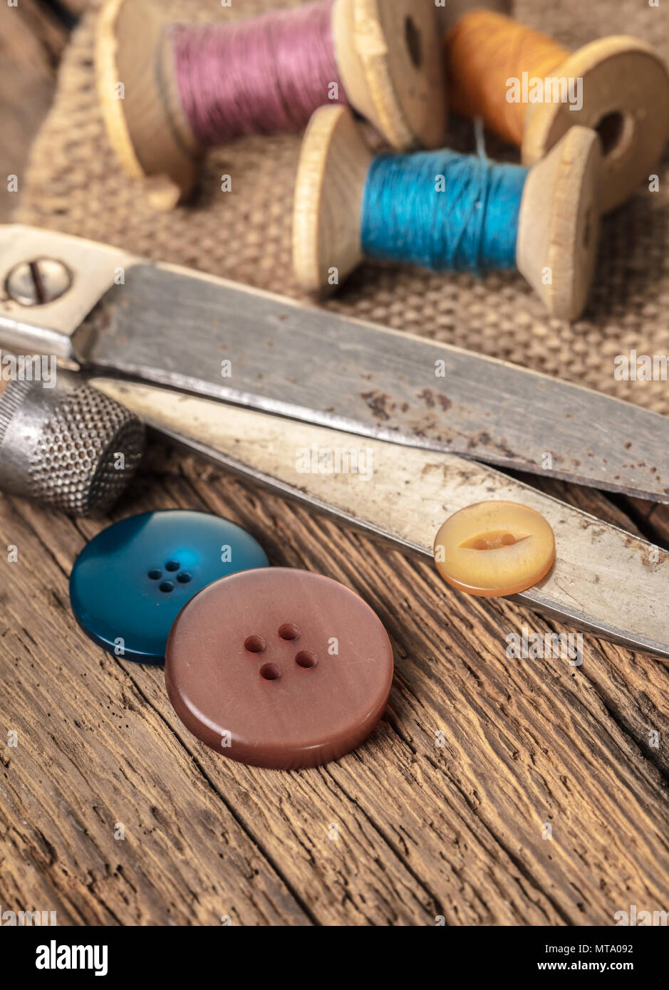 Composition with threads and sewing accessories - scissors, centimeter,  pins on yellow background. Stock Photo by ©nuclear_lily 236814992