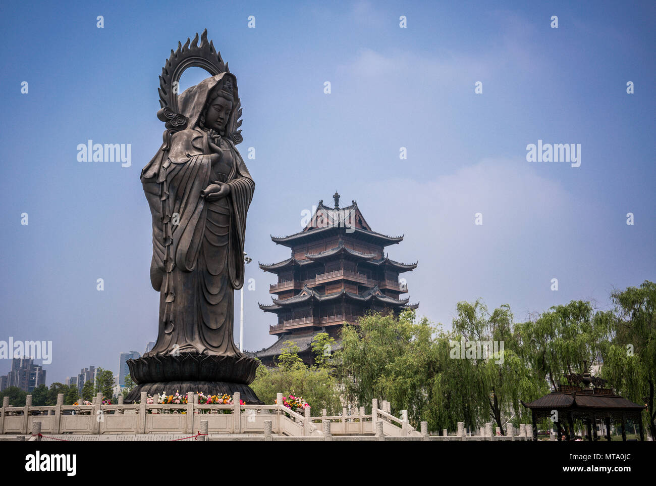 Statue and tower at Guiyuan Buddhist Temple in Wuhan Hubei China Stock Photo