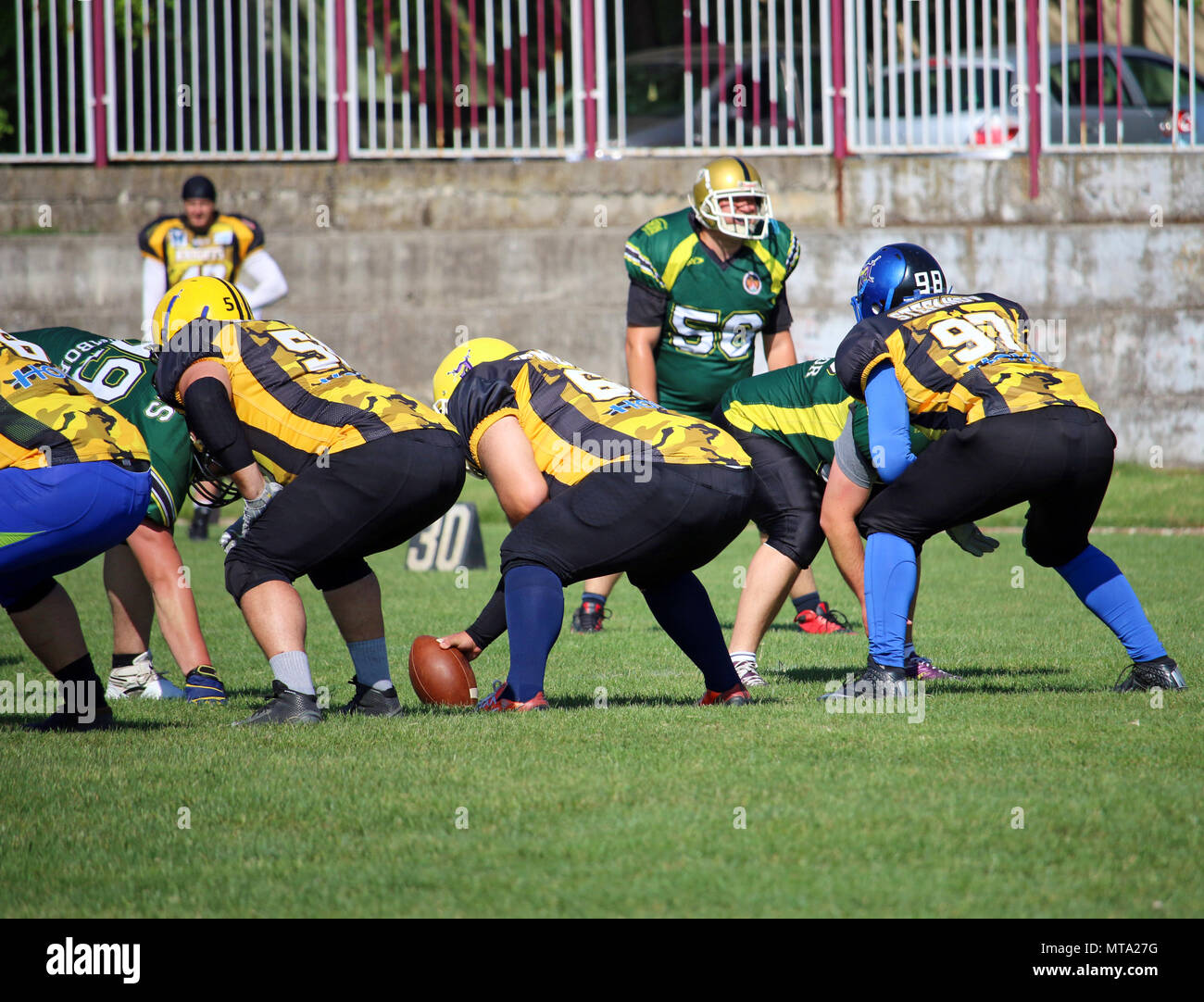American football players on the scrimmage line Stock Photo