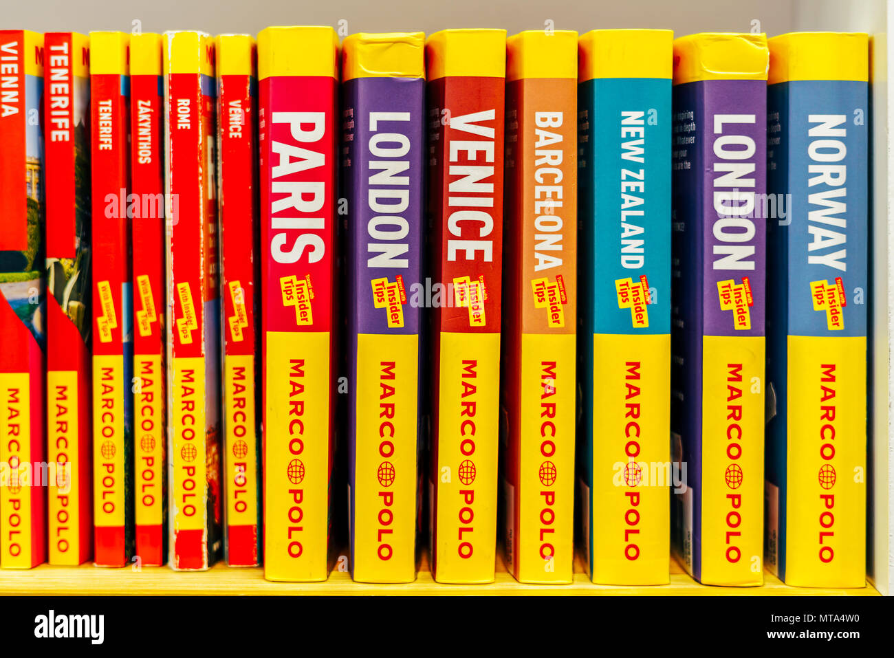 BUCHAREST, ROMANIA - MAY 27, 2018: Cities Of The World And Country Travel Books For Sale On Bookstore Shelf Stock Photo