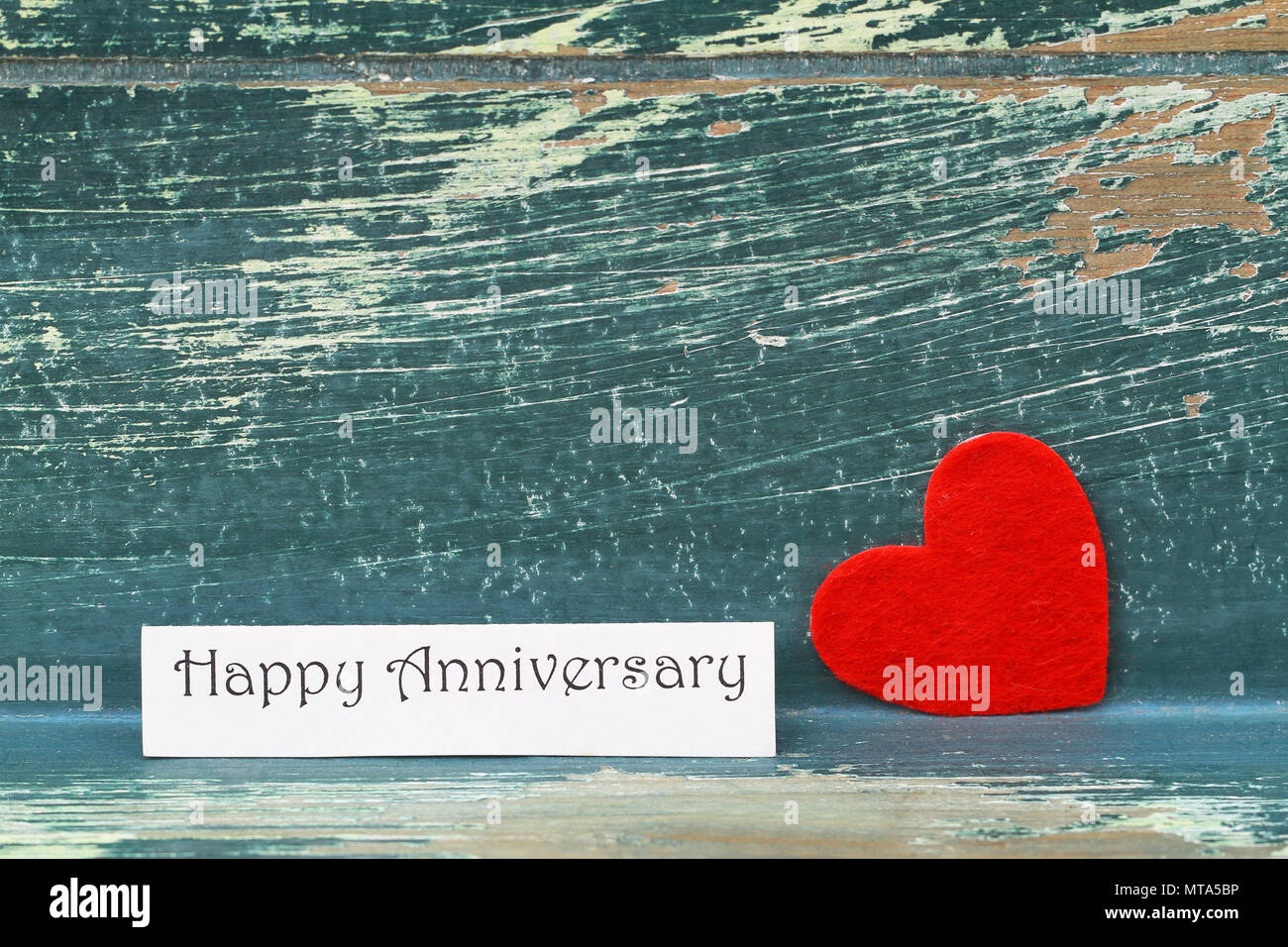 Happy Anniversary Card With Red Heart Leaning Against Rustic Wooden Surface Stock Photo Alamy