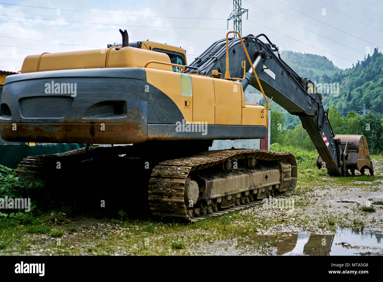 excavator is in the mountains Stock Photo - Alamy