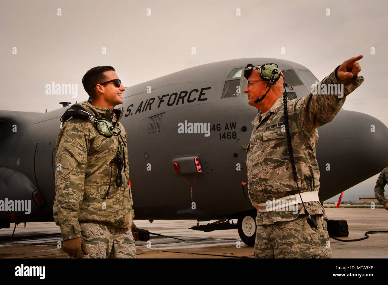 U.S. Air National Guard members Tech. Sgt. Nathan Moon and Tech. Sgt. Joseph Henry Harris  from the 146th Maintenance Squadron inspect a C-130J aircraft at Gowen Field, Idaho, April 20, 2017. Moon and Harris along with a maintenance crew from the 146th Airlift Wing will be providing maintenance service on two C-130J aircraft equipped with the Modular Airborne Fire Fighting System (MAFFS) from the Channel Islands Air National Guard Station during the week-long multi-agency wildfire training with the U.S. Forest Service, CAL FIRE, and multiple Air National Guard and U.S. Air Force Reserve wings. Stock Photo