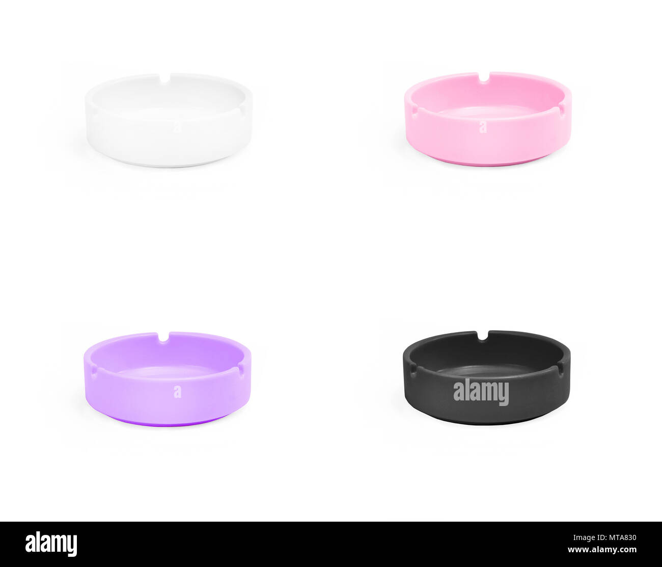 Set of colored ceramic ashtrays isolated on white background Stock Photo