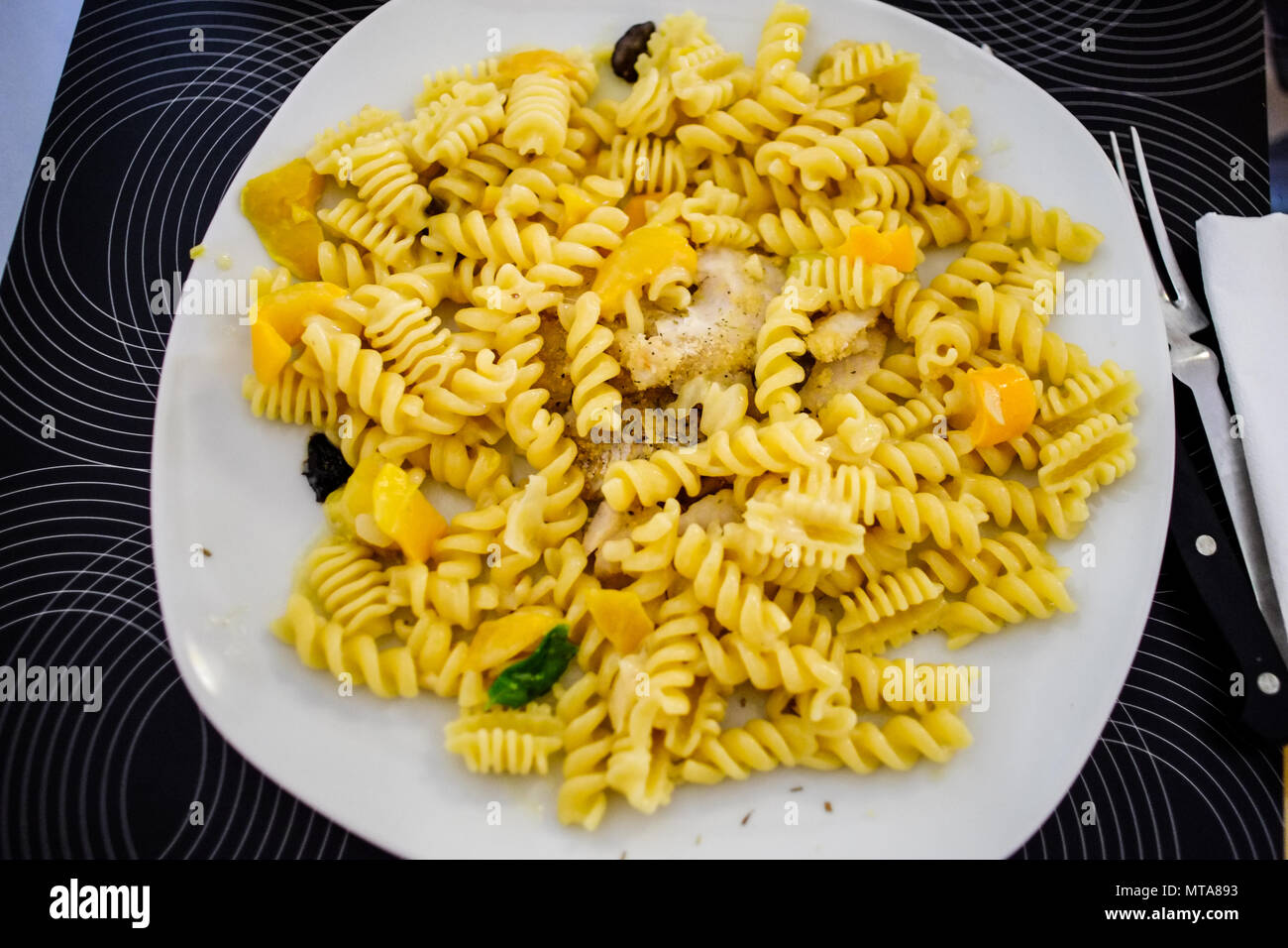 Fusilli type italian pasta with mushrooms. Traditional culture Italy dish Stock Photo