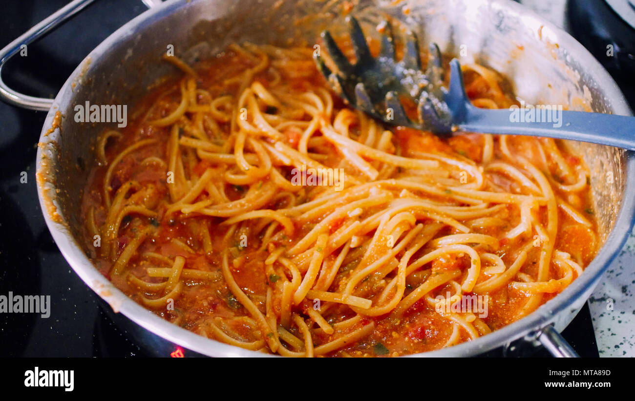 Spaghetti type italian pasta with tomato. Traditional culture Italy dish Stock Photo
