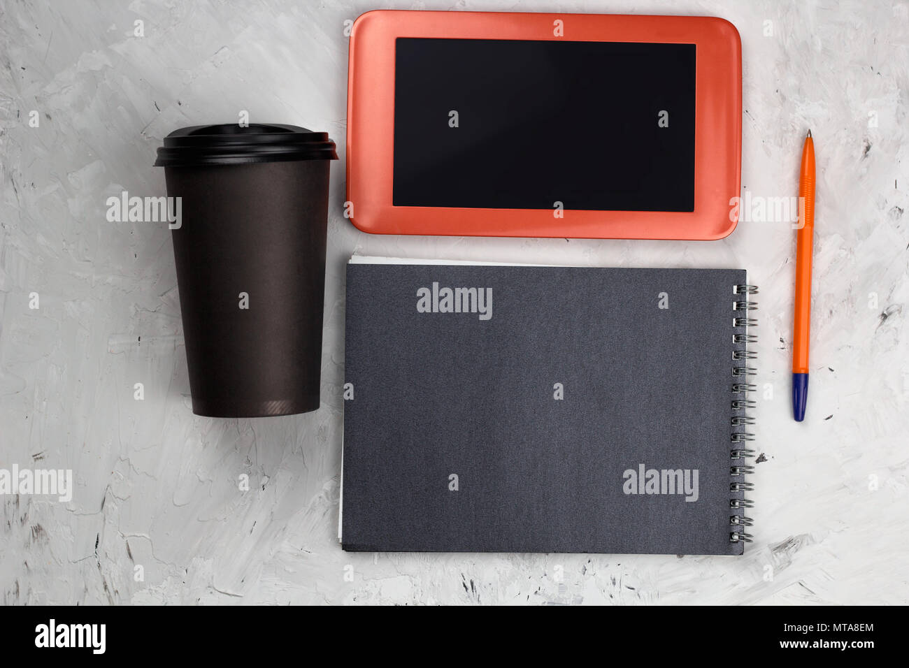 top view coffee to go cup, tablet and notepad Stock Photo