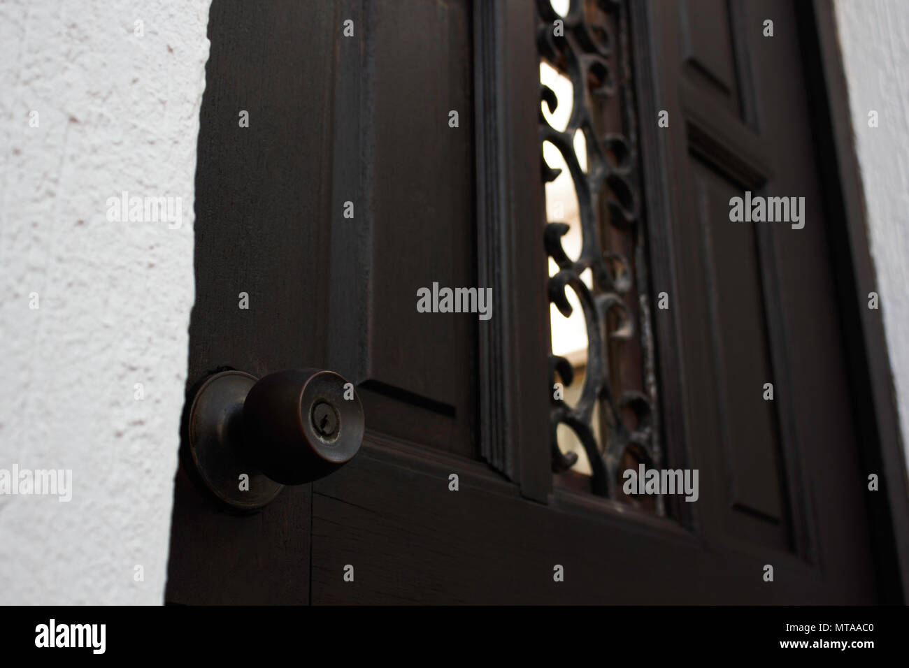 Dark Wood Door With Round Lock Knob Stock Photo