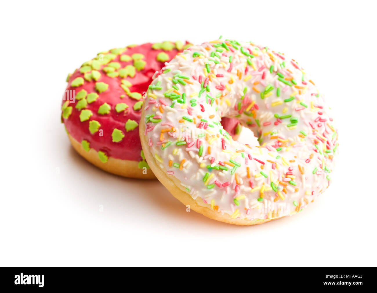 Sweet sprinkled donuts isolated on white background. Stock Photo
