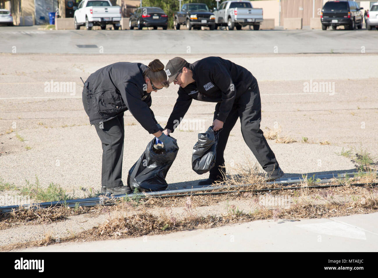 Michelle Bledsoe and Paul Aguilar, Security and Emergency Services, participated in the base-wide cleanup event held aboard Marine Corps Logistics Base Barstow, Calif., April 20. The purpose of the event is to beautify the base and keep weeds and trash at bay. Stock Photo