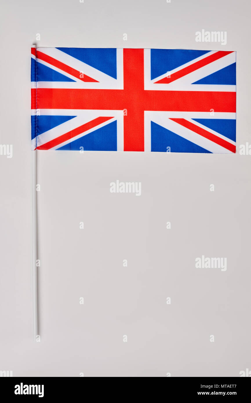 British flag isolated on white background. British flag with pole. Stock Photo